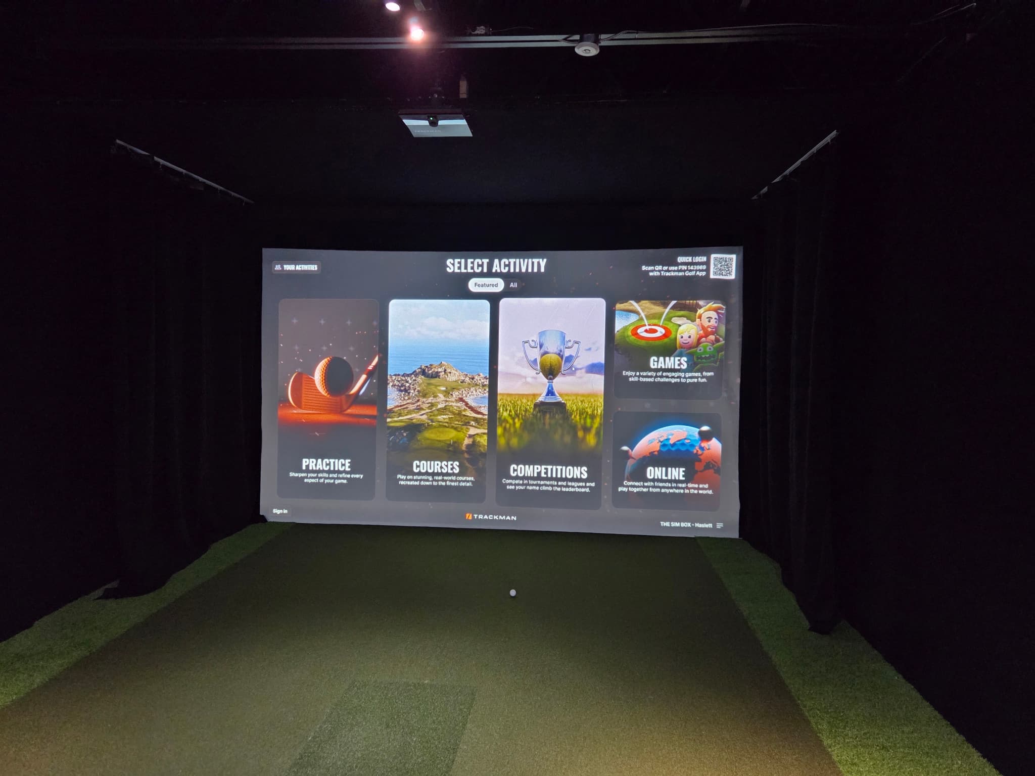 The Sim Box Haslett simulator bay with a projected activity menu